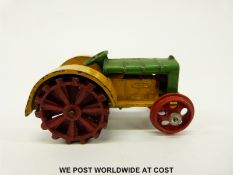Dinky Toys diecast model Fordson N tractor with green and yellow body and red wheels
