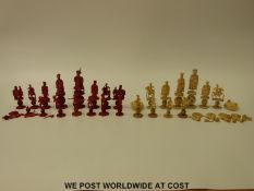 A 19thC Chinese carved ivory puzzle ball chess set, one side stained in red,