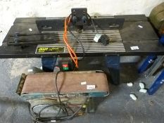 A router table and Clarke belt/disc sander