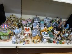 A large collection of novelty teapots and other ceramics