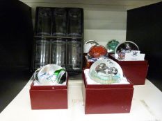 A set of six Portmeirion hi-ball glasses and six boxed paperweights