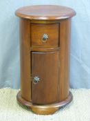 A circular bedside cabinet with drawer and cupboard (D41 x H67cm)