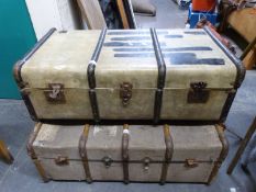 Two wooden and metal bound steamer trunks.