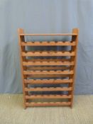 A wooden wine rack to suit 56 bottles (W73 x D26 x H117cm)