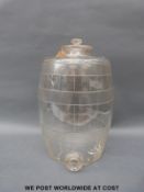 A glass bar top barrel drinks dispenser with graduations marked to side, 36cm tall.