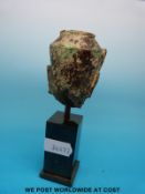 Five post Khmer bronze Buddha heads with gilt remains to the faces,