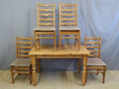 A pine kitchen table and four ladderback chairs (L122 x D76 x H77cm)