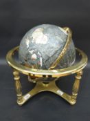 A pietra dura globe with grey coloured sea,