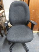 A modern office swivel chair with arms