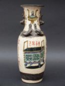 A 19thC Chinese crackle glazed vase with enamelled decoration of a vase and chest, 25.