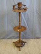 An Edwardian oak two tier pipe or smoker's stand