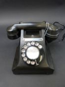 A black bakelite GPO 300 telephone