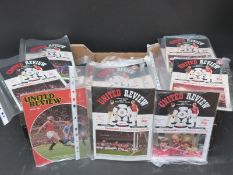 Over 150 Manchester United football programmes dating from 1980-1990