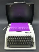 A Frister Rossmann portable sewing machine together with an angle poise hobby magnifier lamp and a