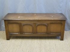 An oak four panel chest,