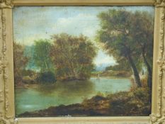 A 19th / early 20th century oil on canvas of a lake with sailing boat, 30x38cm,