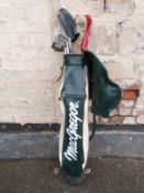 A set of golf clubs, largely Wilson,