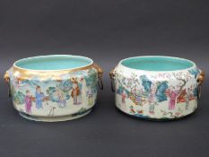 A near pair of 19thC Chinese Daoguang marked famille rose jardinieres decorated all around with