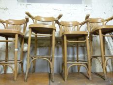 A collection of bentwood chairs and stools
