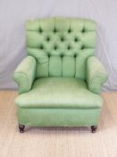 A button back upholstered green armchair