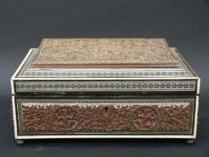 An ornately carved and inlaid Vizagaptam jewellery box with fitted interior,