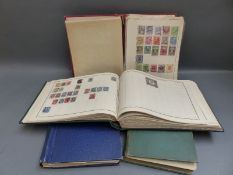 Four albums of world stamps including many early issues