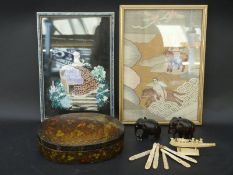 A collection of carved bone items, rosewood elephants,