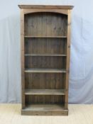 A stained pine bookcase (W86 x D27 x H198cm)