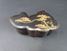 Over 60 Chinese mother-of-pearl gaming counters in a lacquer box