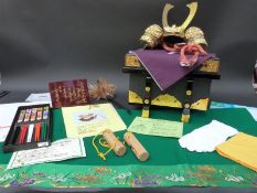 A miniature presentation Samurai helmet in lacquer box