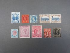 A stockcard of stamps including Sierra Leone Edward Vll £1 purple/red,