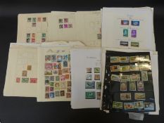 A large quantity of loose album pages of mainly Commonwealth stamps.