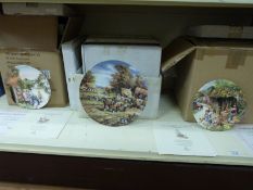 Three boxes of ceramic plates including Wedgwood and Royal Doulton,