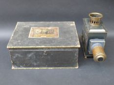 A Ernest Plank magic lantern in original fitted box with a collection of slides