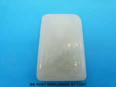 A rectangular jadeite pendant carved with calligraphy to one side and figures to the other, 6.7x4.