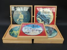 Collection of 18 framed picture disc records including The Beatles, Queen, The Stranglers,