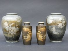 A pair of bronze Japanese vases decorated with buildings and Mount Fuji, 12cm tall,