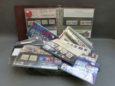 An album and a large quantity of loose GB presentation packs