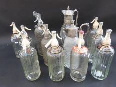 Twelve vintage soda siphons,