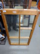 A pine framed mirror (H96 x W55cm)