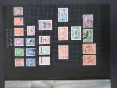 A page of Australian stamps including 1913 Kangaroo 10s-£2 handstamped specimen (SG 14s-16s),