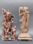 A Chinese carved wooden figure group featuring a fisherman and young boy,