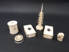 Six early 20thC ivory items comprising a carved lion on a plinth, two pots,