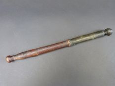 A 19thC tip-staff or truncheon, the turned wooden handle leading to turned brass, weighted top,