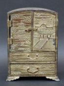 A Japanese jewellery cabinet with embossed decoration,