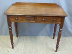 A 19thC mahogany two drawer side table raised on turned legs (W90 x D45 x H73cm)