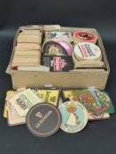 A collection of various beer mats including Guinness,