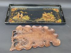 A Chinese lacquer tray decorated in gilt with figures and buildings, 62x29cm,