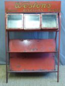 A vintage Weston's biscuits shop display stand with three hinged glass topped containers (W78 x D42