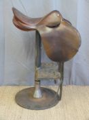 A leather saddle bar stool on industrial steel base